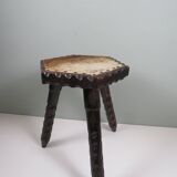 Vintage Spanish stool in carved wood with a leather seat.