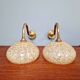 Pair of brass and yellow/white speckled glass wall sconces