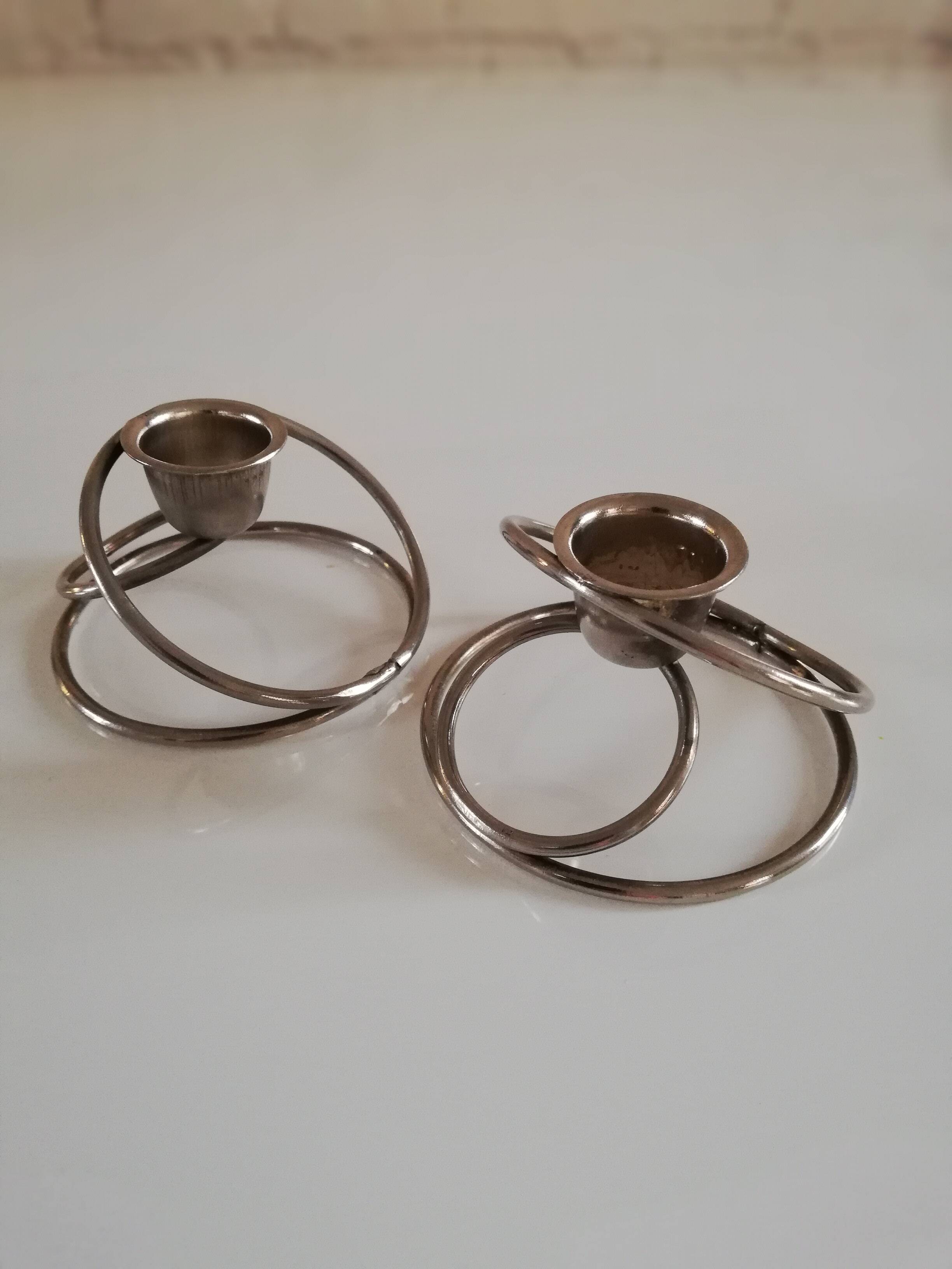 Pair of white metal candle holders