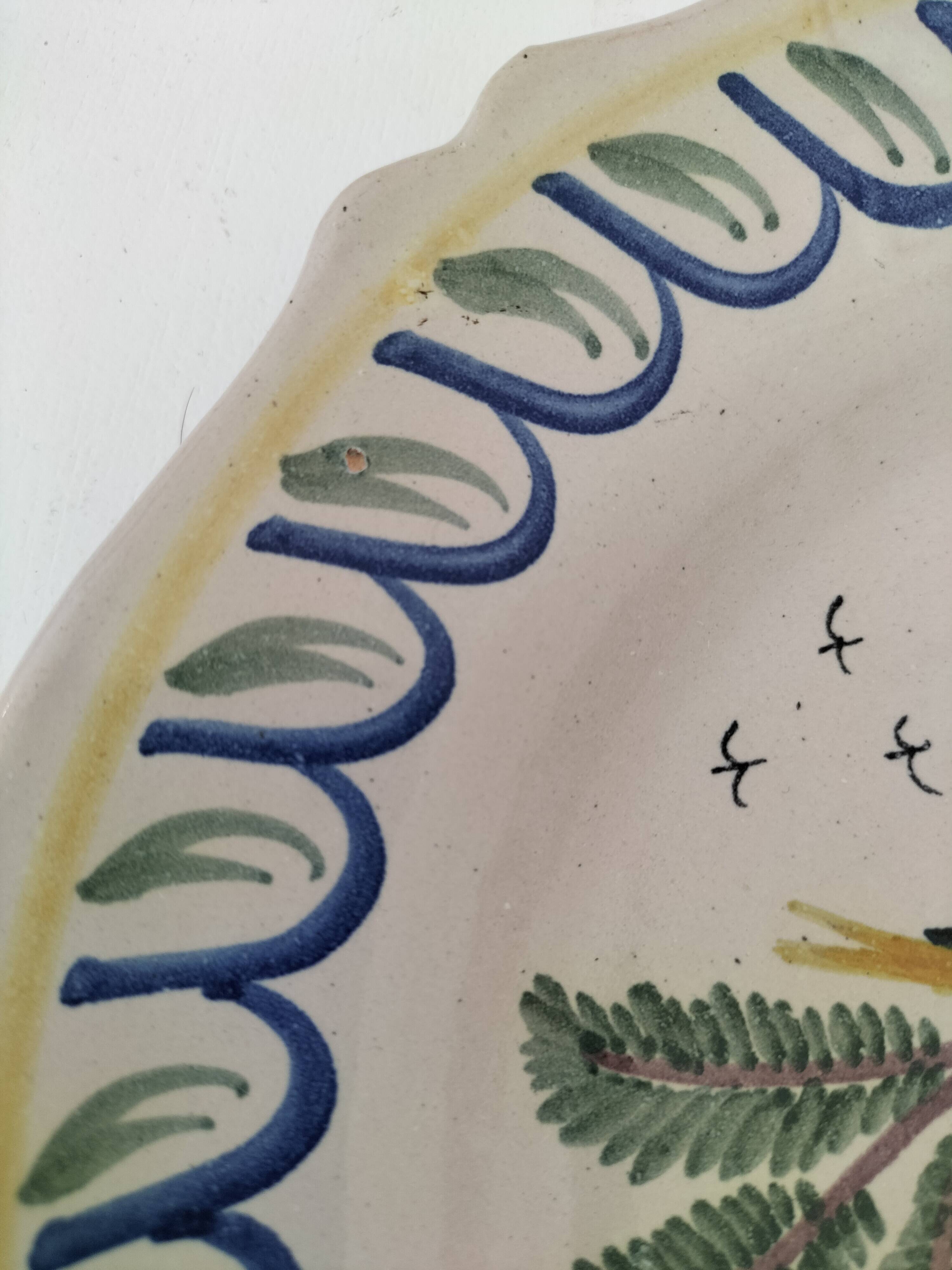 Antique hand-painted earthenware plate – piper and birds