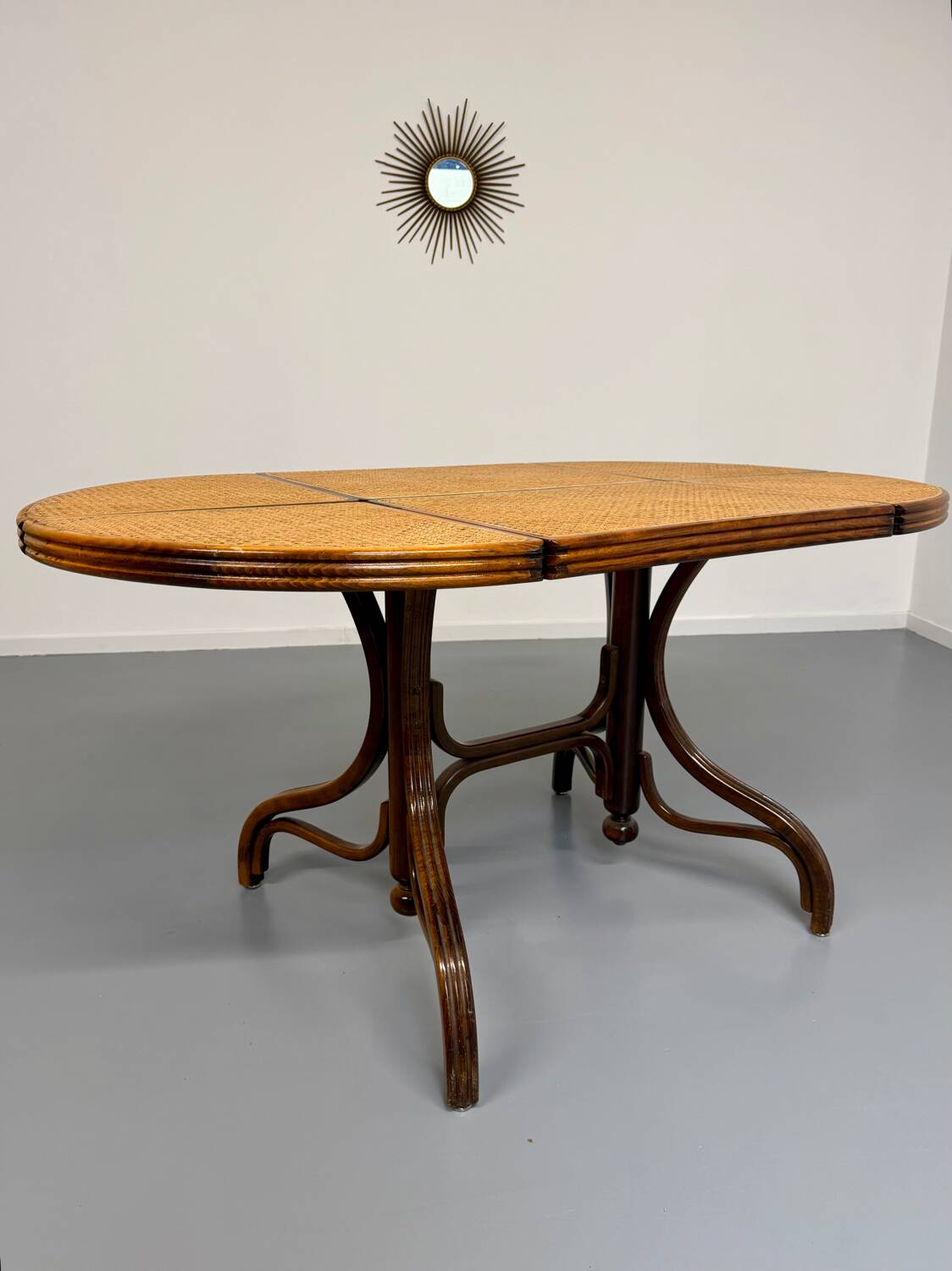 Vintage dining table with a cane top by Mundus from the 1970s.