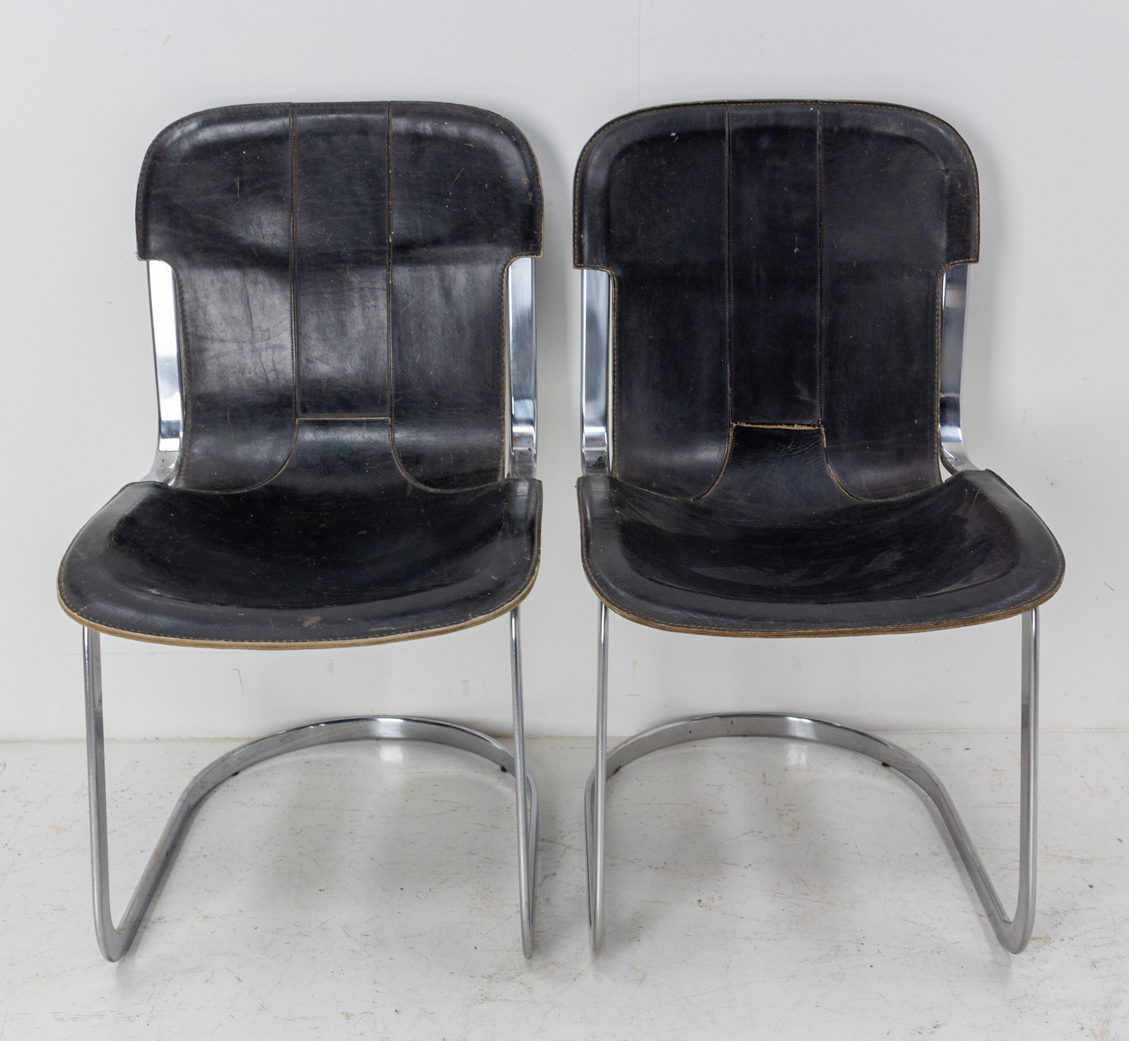 Pair of windmill leather chairs