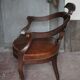 Barber chair in wood and leather with adjustable headrest, office chair.