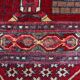 Vintage Afghan hand-knotted prayer rug with Islamic patterns.