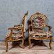 Pair of Louis XV style Baroque armchairs in gilded and carved wood circa 1900