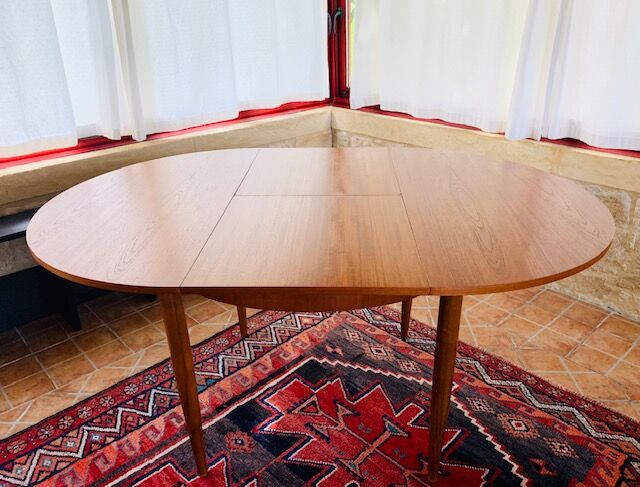 Expandable teak dining table, butterfly extension, circa 60s