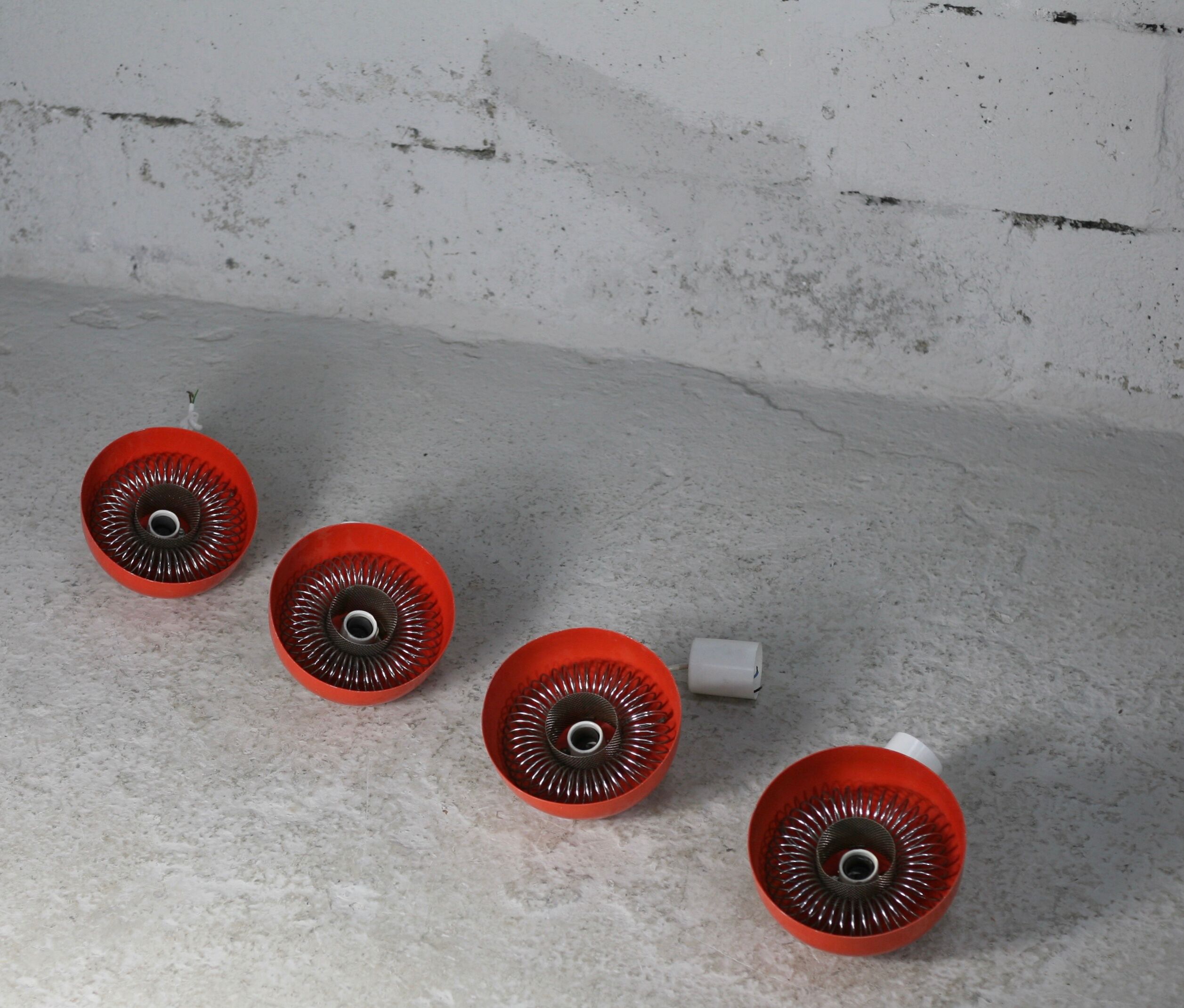 Set of 4 "spring" hanging lamps, orange steel, France, circa 1970
