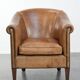 Characterful club chair made of sheepskin leather with light cognac colours