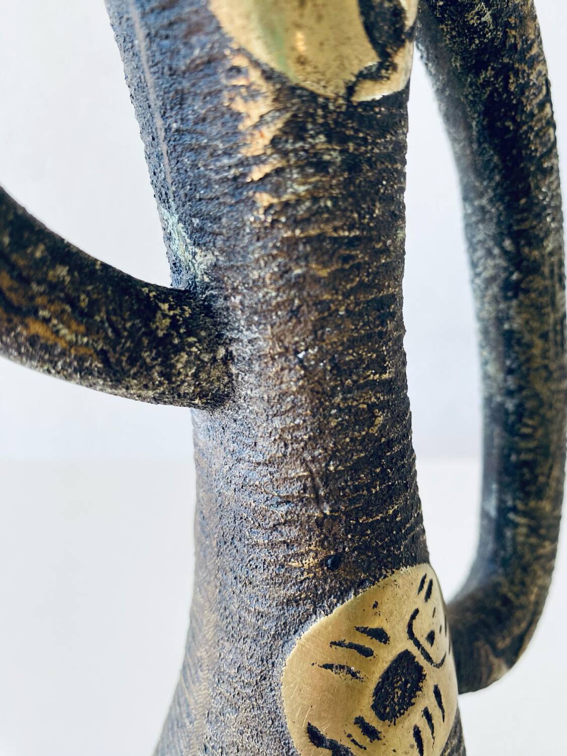 Brutalist bronze vase, the signs of the zodiac