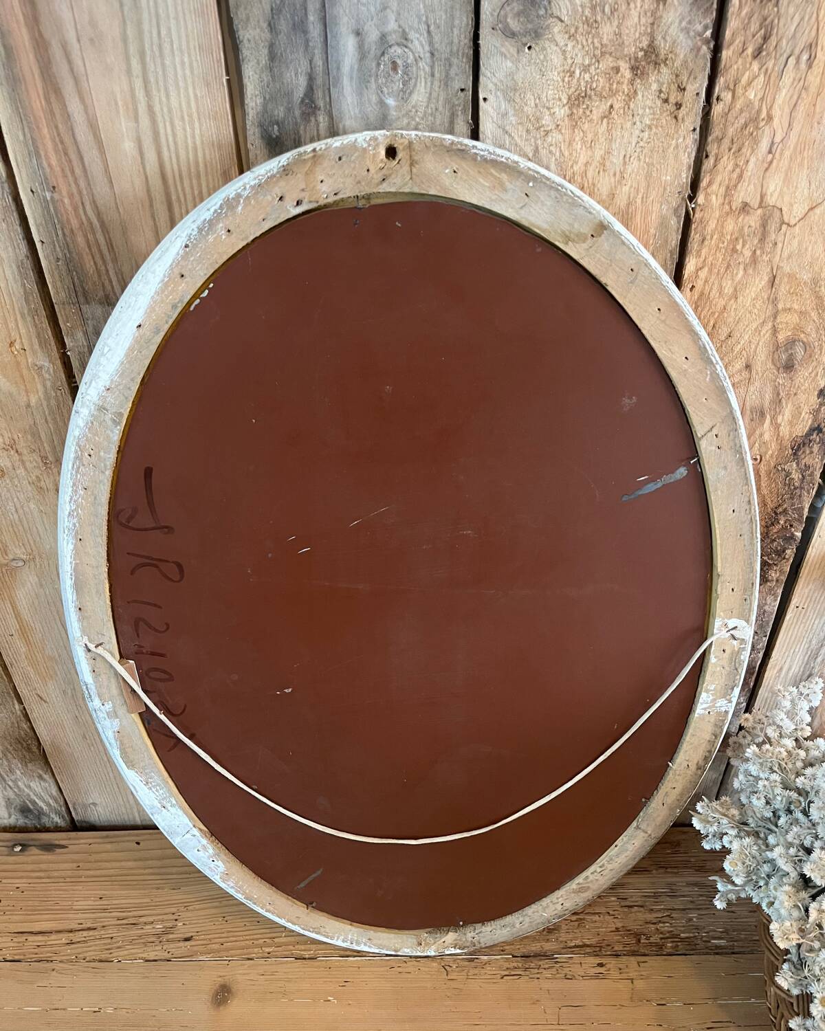White patinated oval mirror