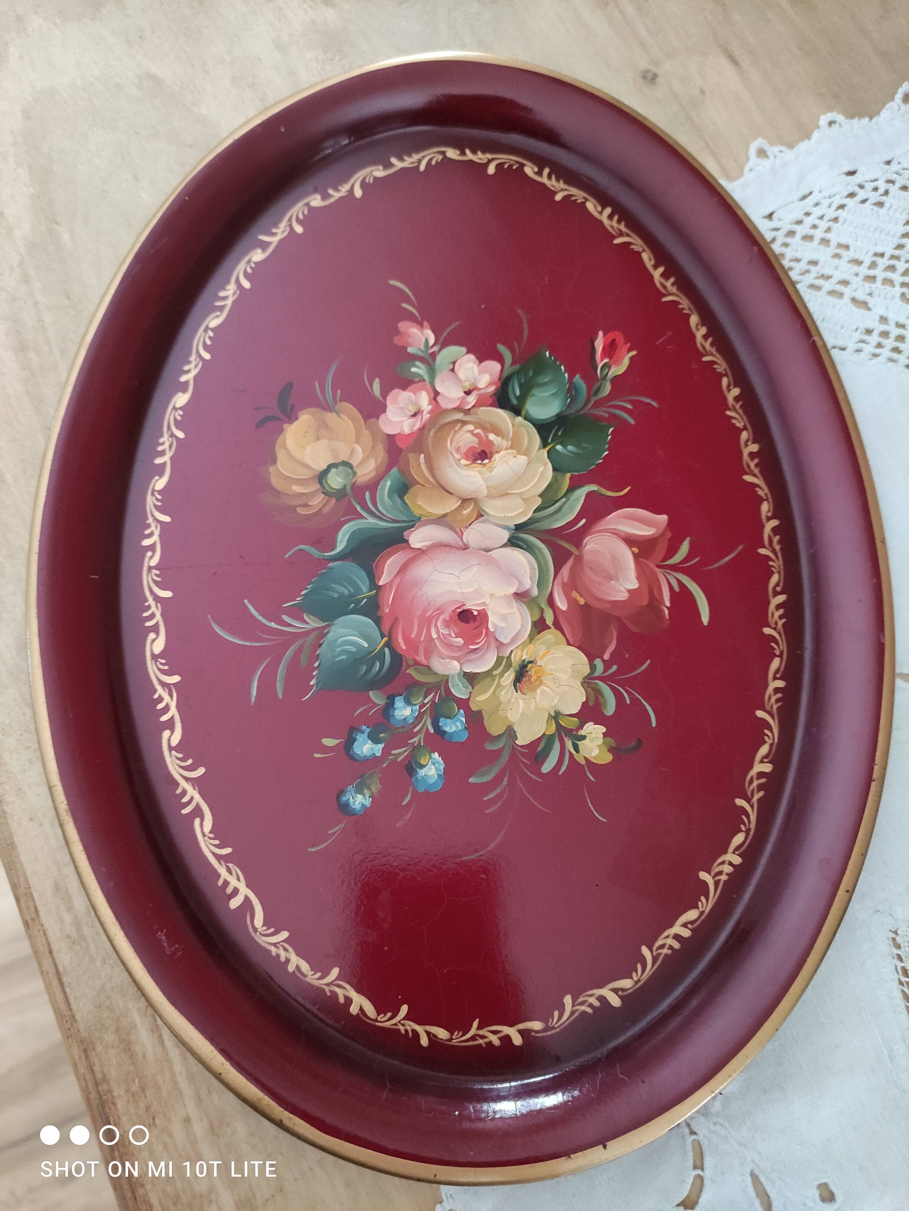 Russian plate in painted sheet metal burgundy old pink decoration and golden frieze