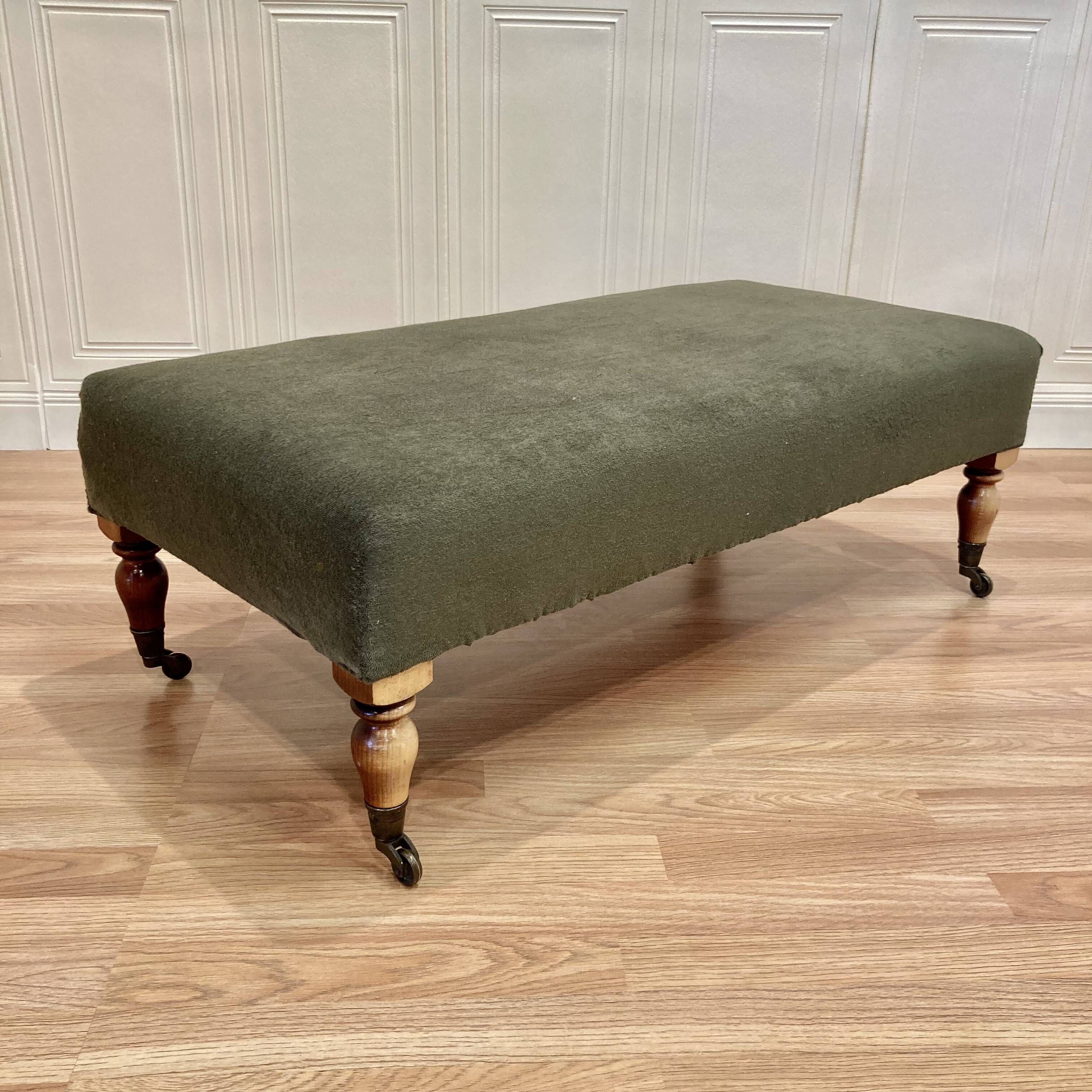 Khaki and oak sofa on casters, 1950s design.