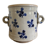 Old pot, sandstone, blue flower decoration