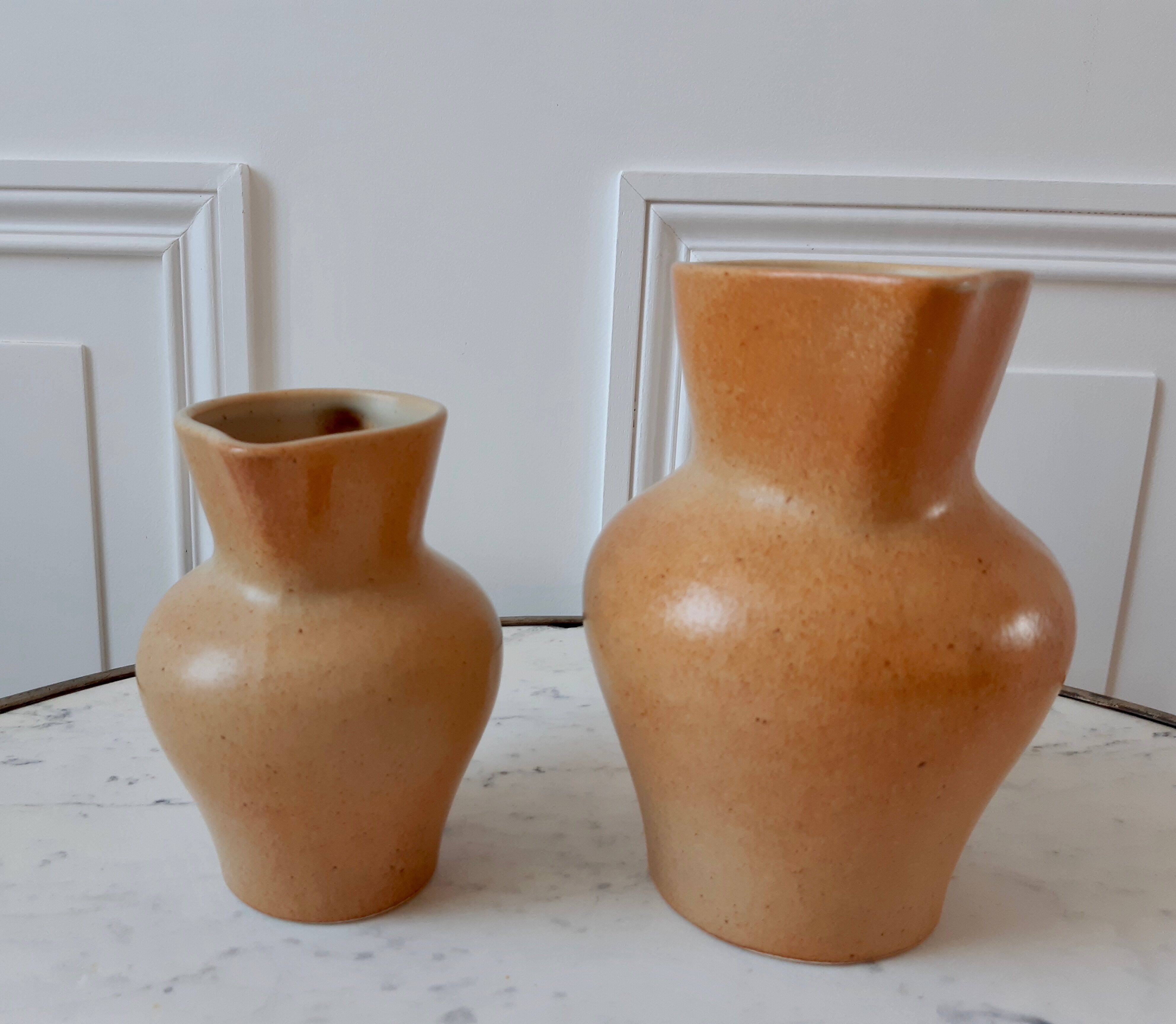 Duo of vintage sandstone pitchers Made In France