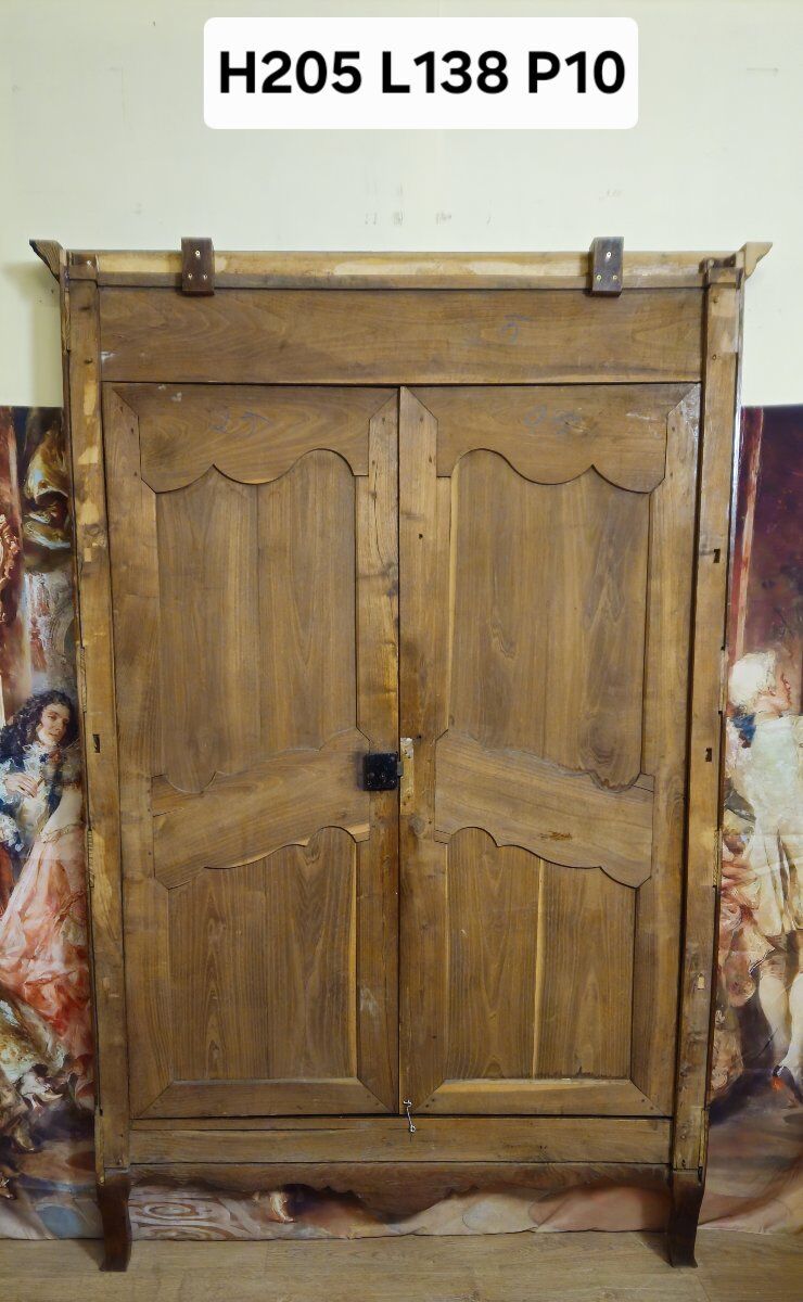 Louis XV period wardrobe façade, solid wood architectural elements, richly carved.