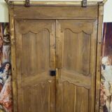 Louis XV period wardrobe façade, solid wood architectural elements, richly carved.