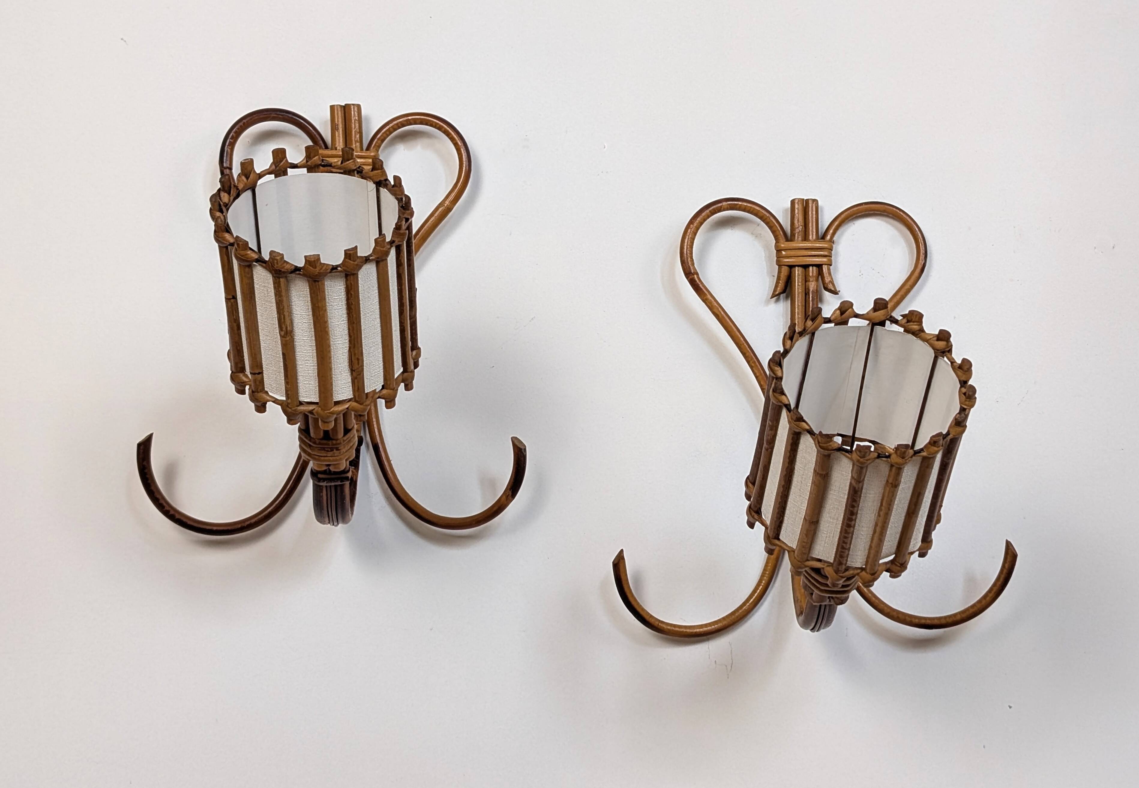 Rattan wall lights by Louis Sognot