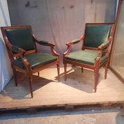 Pair of Louis XVI style armchairs upholstered in green leather.