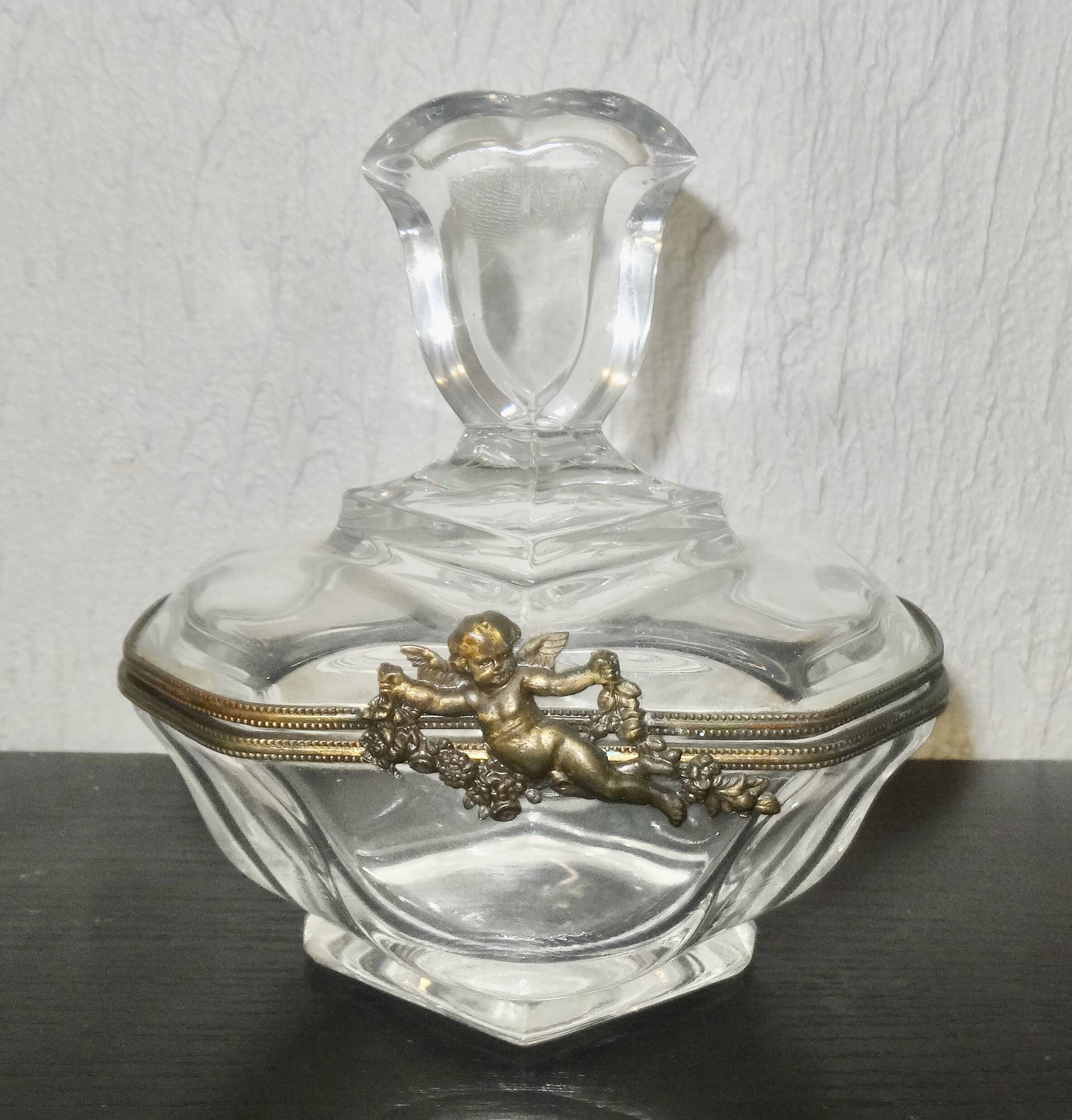 glass jewelry box with brass cherub decoration