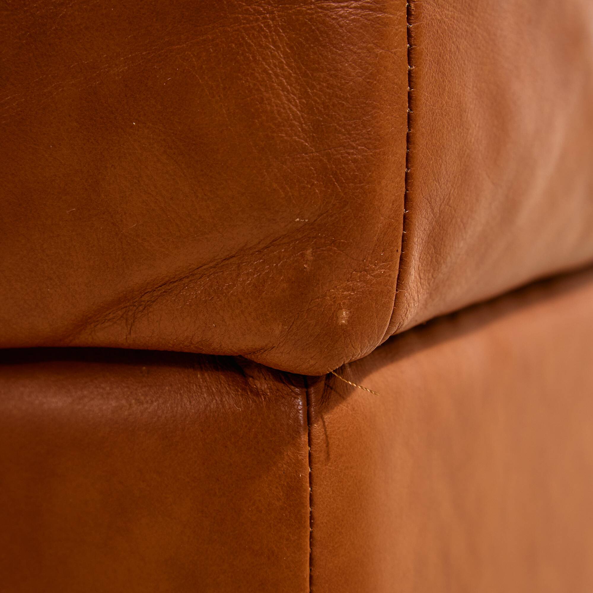 Ottoman with leather upholstery