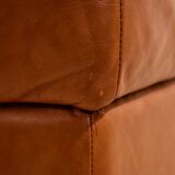 Ottoman with leather upholstery