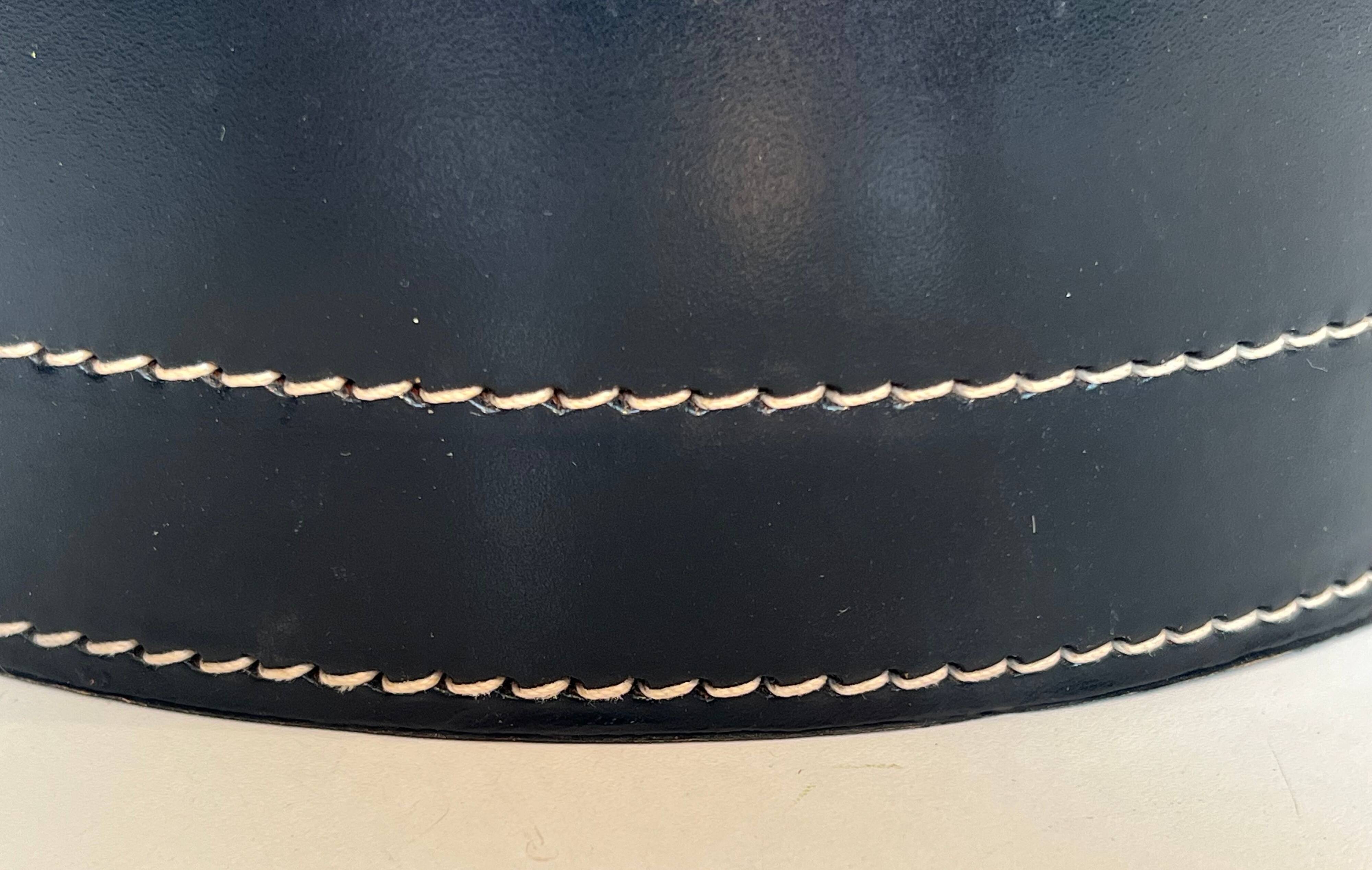 Black leather and brass desk basket