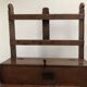 Antique wooden wall shelf that belonged to a religious figure