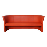 Curved vintage orange canapé with a pop spirit, seventies design piece.