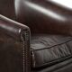 Dark cow leather club armchair with a stylish design in English style