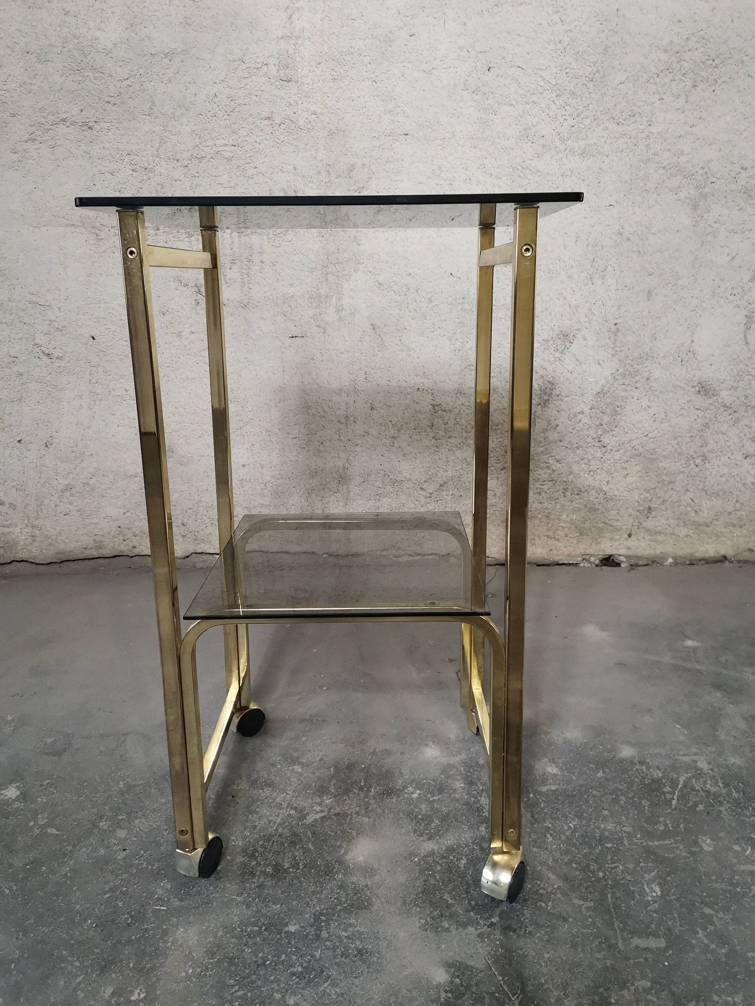 Side Table 1970s smoked glass/gold/wheels