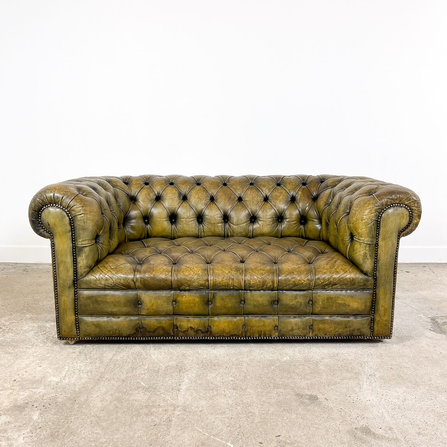 Old vintage leather chesterfield sofa