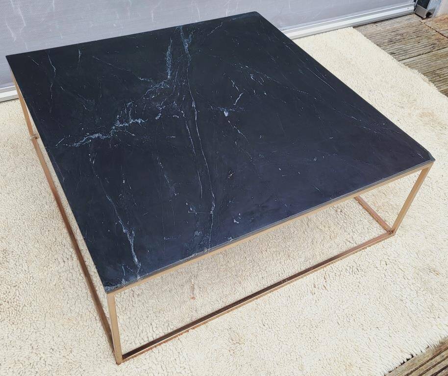 Coffee table or black marble and brass display "in its own juice"