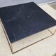Table basse en marbre noir et laiton