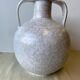 Vase - forme  boule à deux anses  en grés emaillé de couleur grège clair