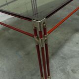 Postmodern Italian design coffee table in smoked glass with red steel structure