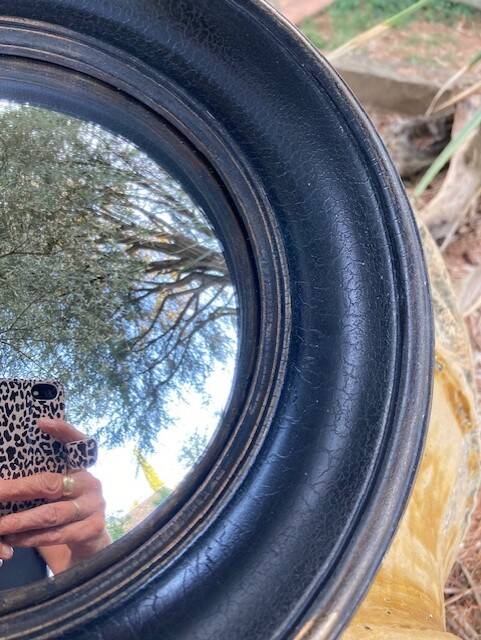 Convex mirror, also known as a witch's mirror.