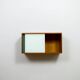 A vintage mid-century wall hung oak cabinet, green & white glass doors