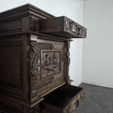 Renaissance-style cabinet in solid oak decorated with chimeras and caryatids