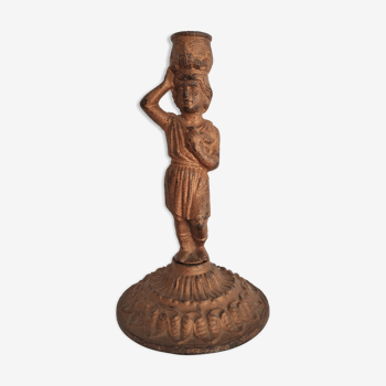 19th century candlestick with water-carrying character