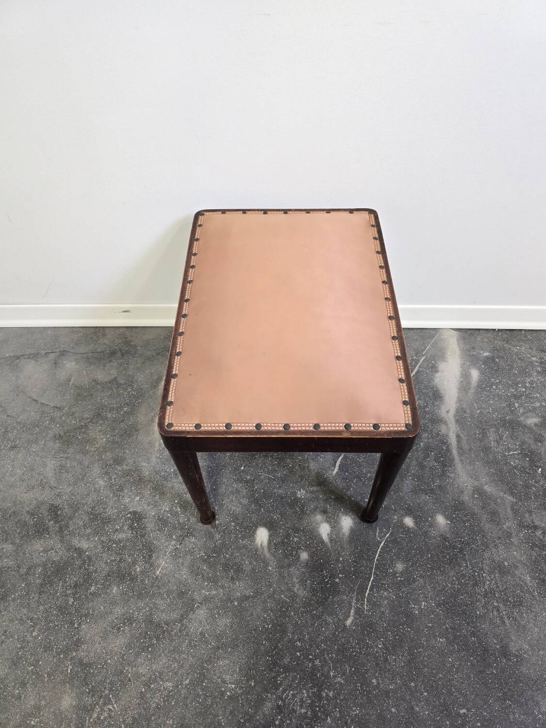 Vintage wooden ottoman from the 1940s with a silk top and studded trim.