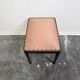 Vintage wooden ottoman from the 1940s with a silk top and studded trim.