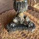 Empire candlestick in gilded and patinated bronze, decorated with acanthus leaves and griffins.