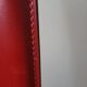 Red leather chairs by Arper