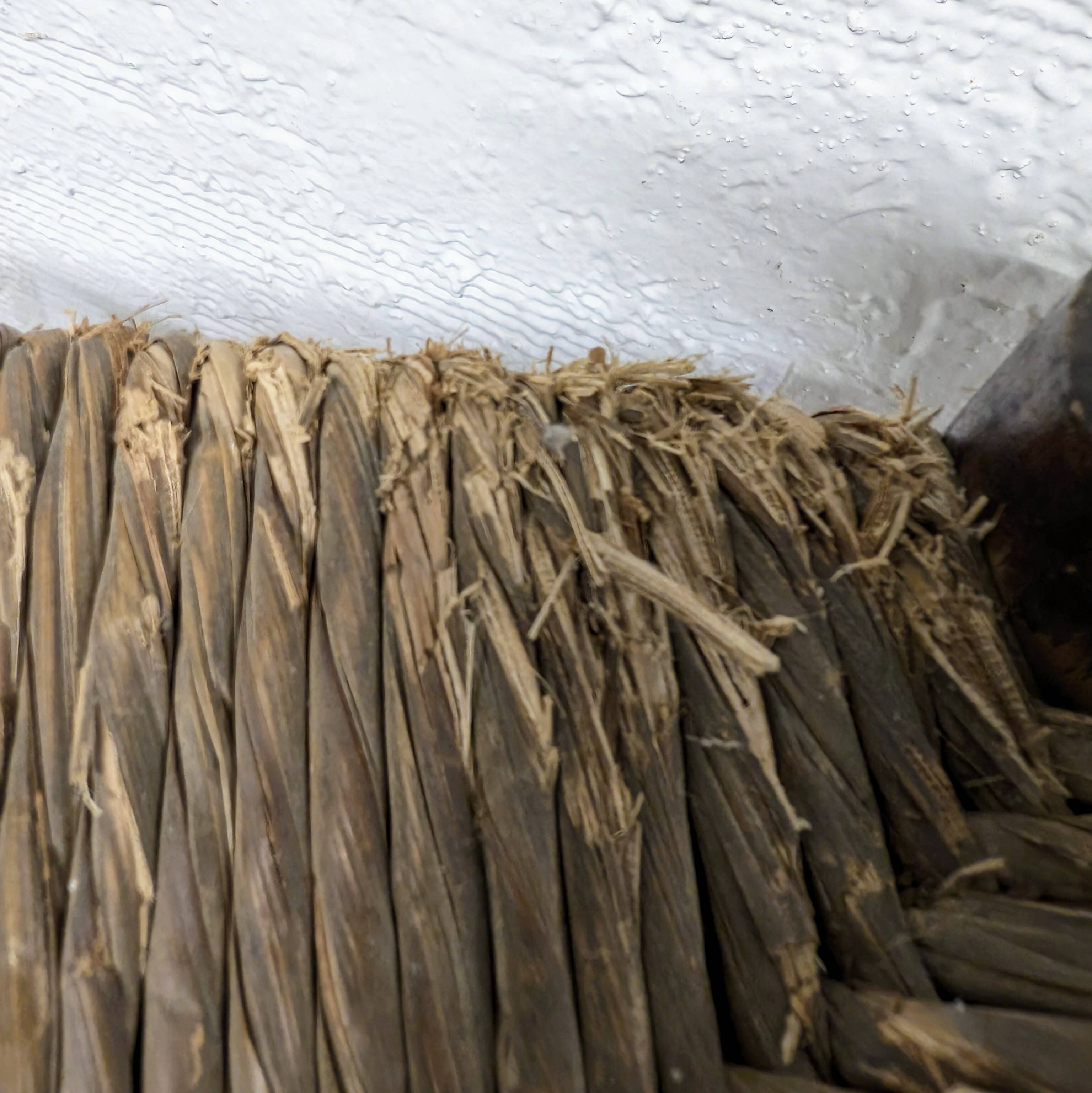 High stool made of wood and straw