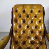 Pair of padded Chesterfield armchairs