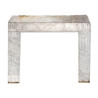 Old fireplace in white marble veined Louis XVI