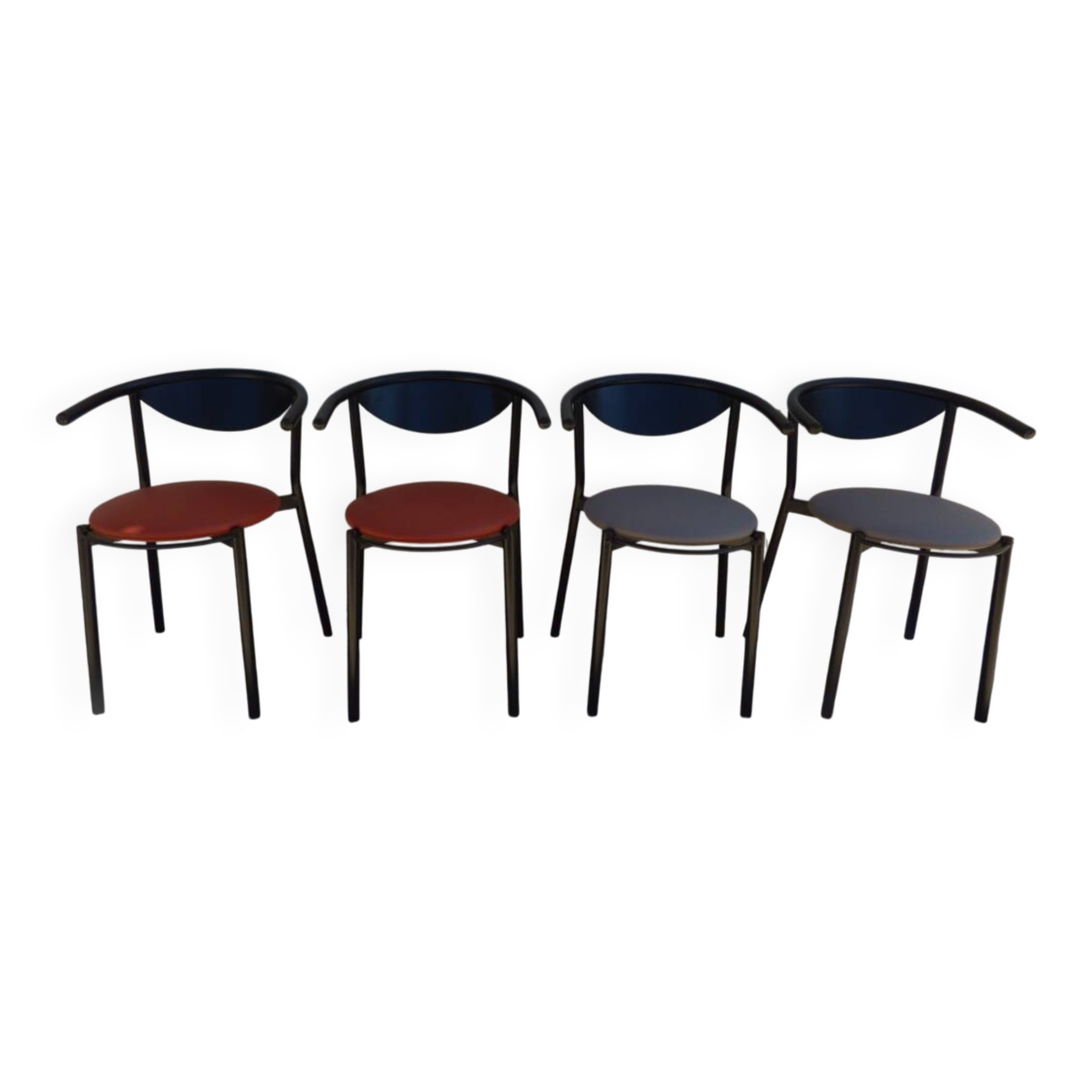 4 gondola-style chairs with a sturdy metal frame and faux leather.