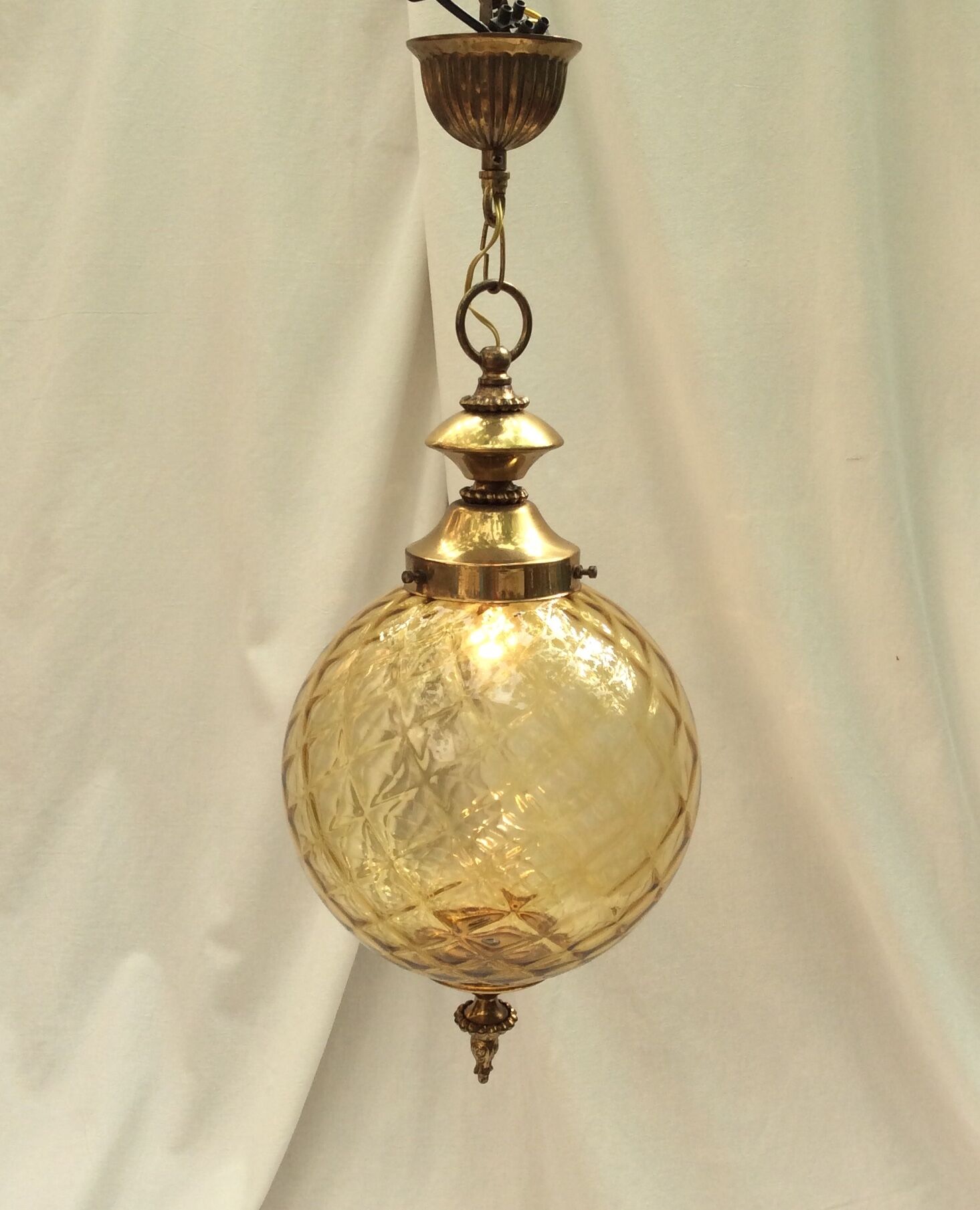 Amber glass suspension with brass