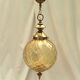 Amber glass suspension with brass