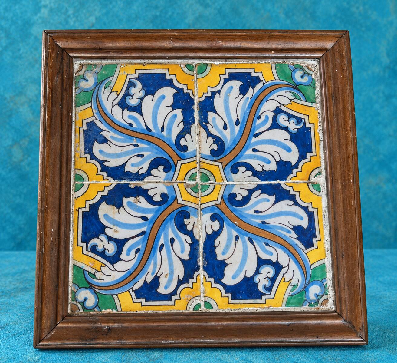 Panel of four Catalan tiles, 17th century, framed.